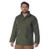Rothco M-65 Field Jacket M65FJ, front view of a man wearing a military-style dark green field jacket with multiple pockets, stand-up collar, and buttoned epaulets on shoulders. Thumbnail Image