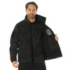 Rothco Midnight Camo Special Ops Soft Shell Jacket MCSOSSJ, a man wearing a black camo tactical jacket with multiple pockets, zippers, and a high collar. Thumbnail Image