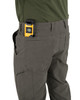 Iron & Haft Men's Every Day Joe 8 Pocket Stretch Work Pant, close-up of the work pant with a yellow and black laser level tool in the front pocket.