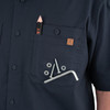 Iron & Haft Tradesman Short Sleeve Stretch Canvas Work Shirt, a navy blue work shirt featuring a chest pocket with a pencil, screws, washers, and an Allen wrench for job site convenience.