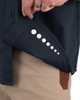 Iron & Haft Tradesman Short Sleeve Stretch Canvas Work Shirt TRADESMAN-SSS, close-up of the shirt's cuff with size labels, navy blue color, worn with beige pants.