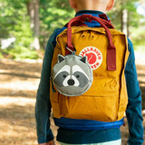 Raccoon First Aid Kit clipped to yellow backpack 