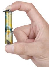 Olight i3E EDC Palm Breeze Keychain Flashlight, small yellow and black palm leaf pattern flashlight held between thumb and forefinger. Thumbnail Image