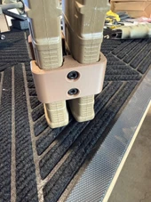 LAPG PMAG Magazine Coupler, tan plastic magazine coupler holding multiple green magazines together. Thumbnail Image