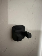 LAPG AR-15 Buffer Tube Wall Mount, black wall mount bracket for rifle buffer tubes attached to a wall, model TDP-ARWM. Thumbnail Image