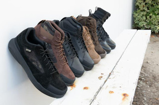 OTB Boots T-KOOL Low Tactical Boot, a collection of five pairs of tactical shoes in black, brown, and dark grey, displayed on a white bench outdoors.