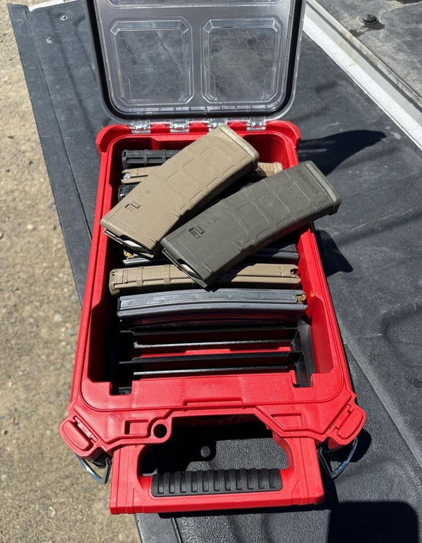 LAPG Magazine Storage Insert for Milwaukee® PACKOUT™ Deep Bin, red and black plastic storage case filled with magazine clips and firearm accessories.
