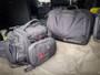 Kitanica Flip Admin Pouch 112-KN, black tactical bag and luggage pouches in vehicle trunk.
