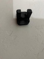 LAPG AR-15 Buffer Tube Wall Mount TDP-ARWM, a black wall-mounted firearm accessory for AR-15 rifles, designed to hold and support the buffer tube securely.