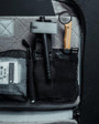 Eberlestock Fade Tactical Admin Pouch FA4MB, inside view showing organization compartments with various tactical tools and accessories.