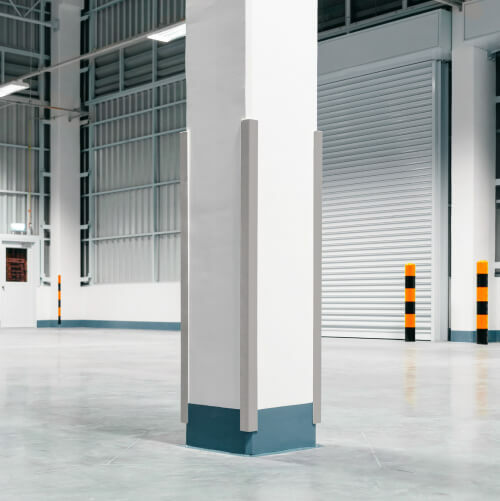 Well lit warehouse with corner guards on support pillars