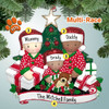 image of Mixed Race Family of Three Opening Gifts by Christmas Tree ornament