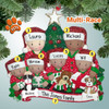 image of Mixed Race Family of Six Opening Gifts by Christmas Tree ornament