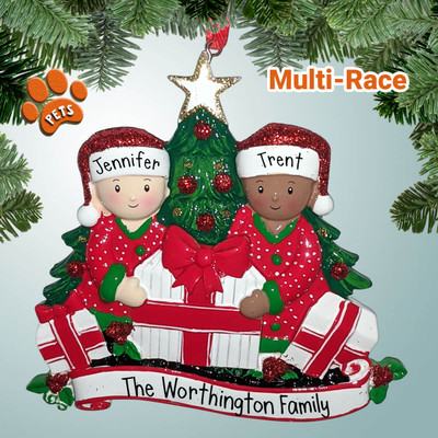 image of Mixed Race Couple Opening Gifts by Christmas Tree ornament image of Mixed Race Couple Opening Gifts by Christmas Tree ornament