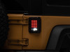 Raxiom 07-18 Jeep Wrangler JK LED Tail Lights- Black Housing (Smoked Lens) - J115435