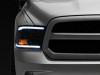 Raxiom 09-18 Dodge RAM 1500/2500/3500 Axial Headlights w/ SEQL LED Bar- Blk Housing (Clear Lens) - R131482