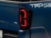 Raxiom 16-23 Toyota Tacoma LED Tail Lights- Blk Housing (Smoked Lens) - TT32385