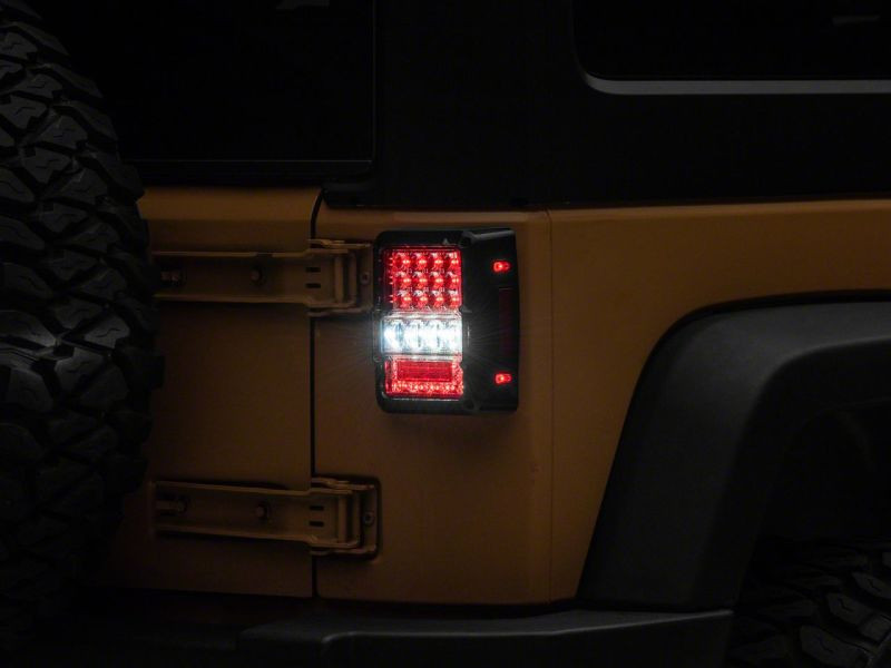 Raxiom 07-18 Jeep Wrangler JK Axial Series Lux LED Tail Lights- Blk Housing (Clear Lens) - J141596