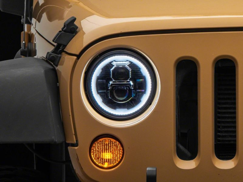 Raxiom 07-18 Jeep Wrangler JK Axial 7-In LED Headlights w/ DRL Turn Signals- Blk Housing (Clear) - J173078