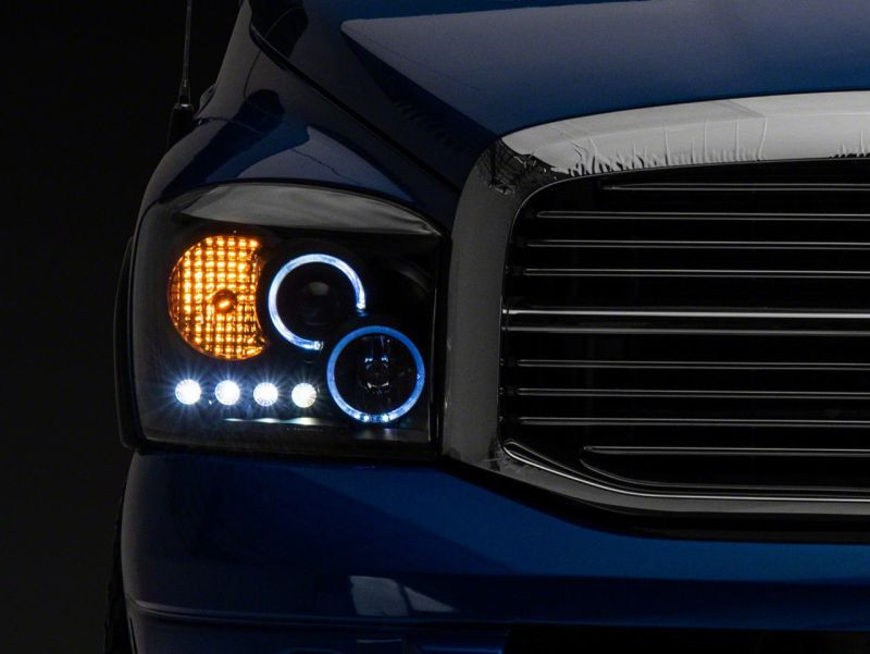 Raxiom 06-08 Dodge RAM 1500 LED Halo Projector Headlights- Blk Housing (Clear Lens) - R110149
