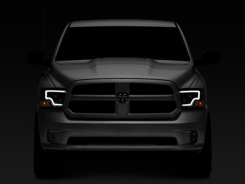 Raxiom 09-18 Dodge RAM 1500 LED Bar Headlights- Black Housing (Clear Lens) - R117803