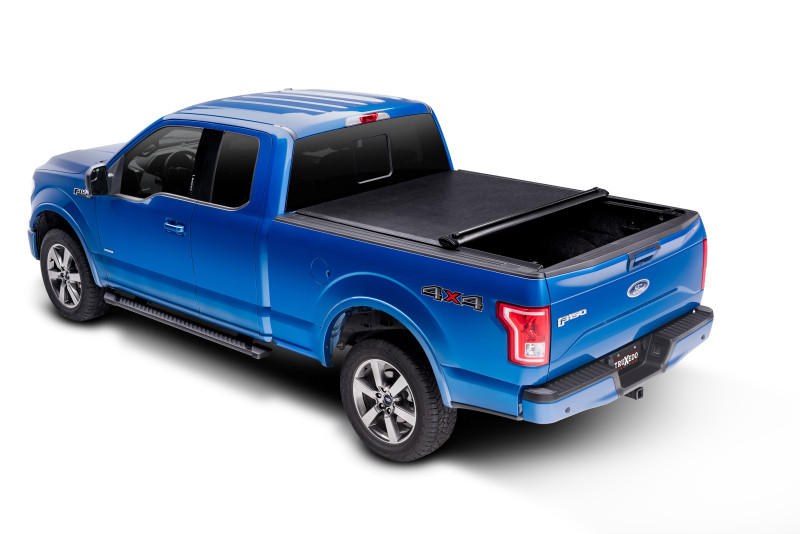 Truxedo 05-15 Nissan Navara w/Rack 4ft 10in Lo Pro International Bed Cover - 592401