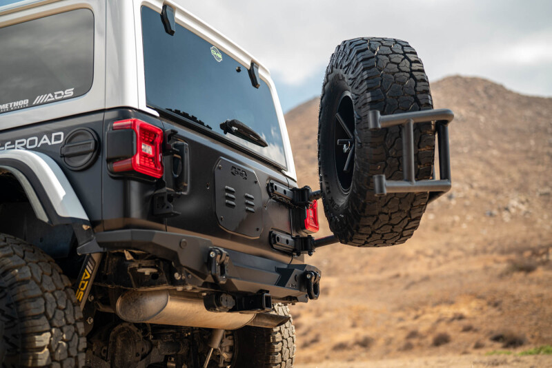DV8 18-25 Jeep Wrangler JL Body Mounted Tire Carrier - TCJL-14 Photo - out of package