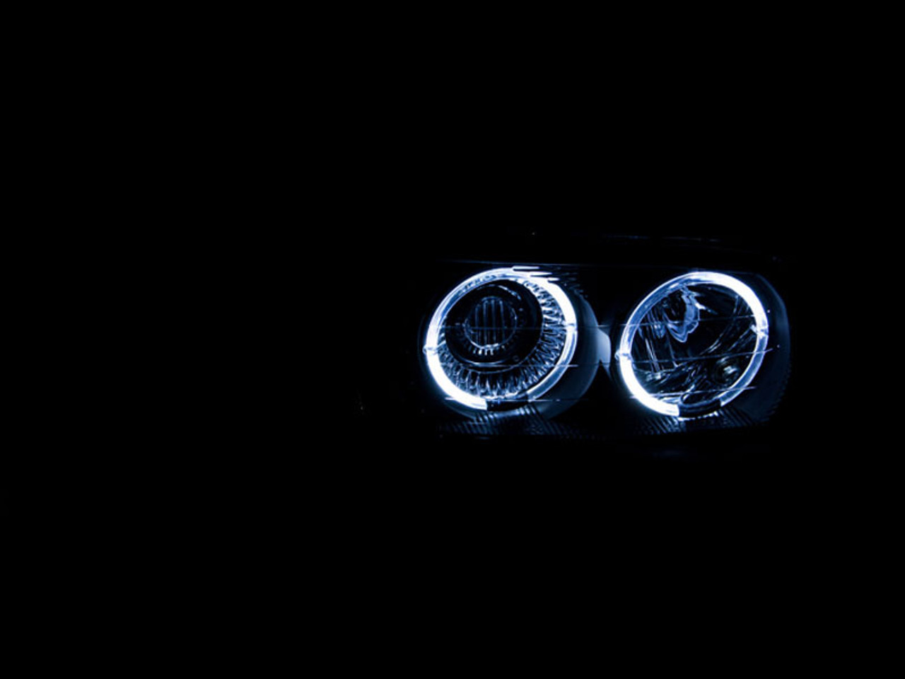 ANZO 1999-2006 Gmc Sierra 1500 Projector Headlights w/ Halo Black - 111192