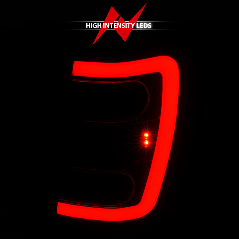 ANZO 1999-2004 Jeep Grand Cherokee LED Tail Lights w/ Light Bar Black Housing Smoke Lens - 311395