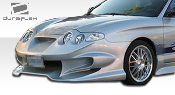 2000-2001 Hyundai Tiburon Duraflex Vader Front Bumper Cover - 1 Piece / Vehicle Year Make Model Trim - 2000-2001-Hyundai Tiburon ALL / Product Type - Front Bumper / Style Name -Vader / Kit Material - FRP (Fiberglass Reinforced Plastics) / Notes -