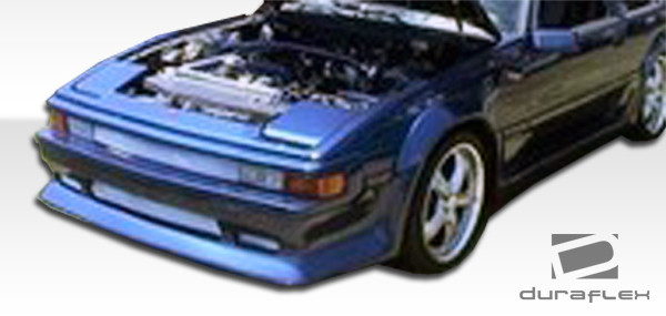 1982-1986 Toyota Supra Duraflex F-1 Front Lip Under Spoiler Air Dam - 1 Piece / Vehicle Year Make Model Trim - 1982-1986-Toyota Supra ALL / Product Type - Front Lip/Add On / Style Name -F-1 / Kit Material - FRP (Fiberglass Reinforced Plastics) / Notes -