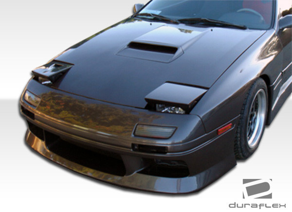 1986-1991 Mazda RX-7 Duraflex M-1 Sport Front Bumper Cover - 1 Piece / Vehicle Year Make Model Trim - 1986-1991-Mazda RX7 ALL / Product Type - Front Bumper / Style Name -M-1 / Kit Material - FRP (Fiberglass Reinforced Plastics) / Notes -