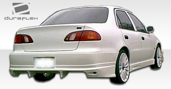 1998-2002 Toyota Corolla Duraflex Bomber Rear Bumper Cover - 1 Piece / Vehicle Year Make Model Trim - 1998-2002-Toyota Corolla ALL / Product Type - Rear Bumper / Style Name -Bomber / Kit Material - FRP (Fiberglass Reinforced Plastics) / Notes -