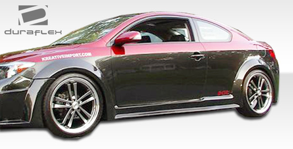 2005-2010 Scion tC Duraflex Touring Wide Body Side Skirts Rocker Panels - 2 Piece / Vehicle Year Make Model Trim - 2005-2010-Scion TC ALL / Product Type - Sideskirts / Style Name -Touring / Kit Material - FRP (Fiberglass Reinforced Plastics) / Notes - Note: must be used in conjunction with complete wide body kit