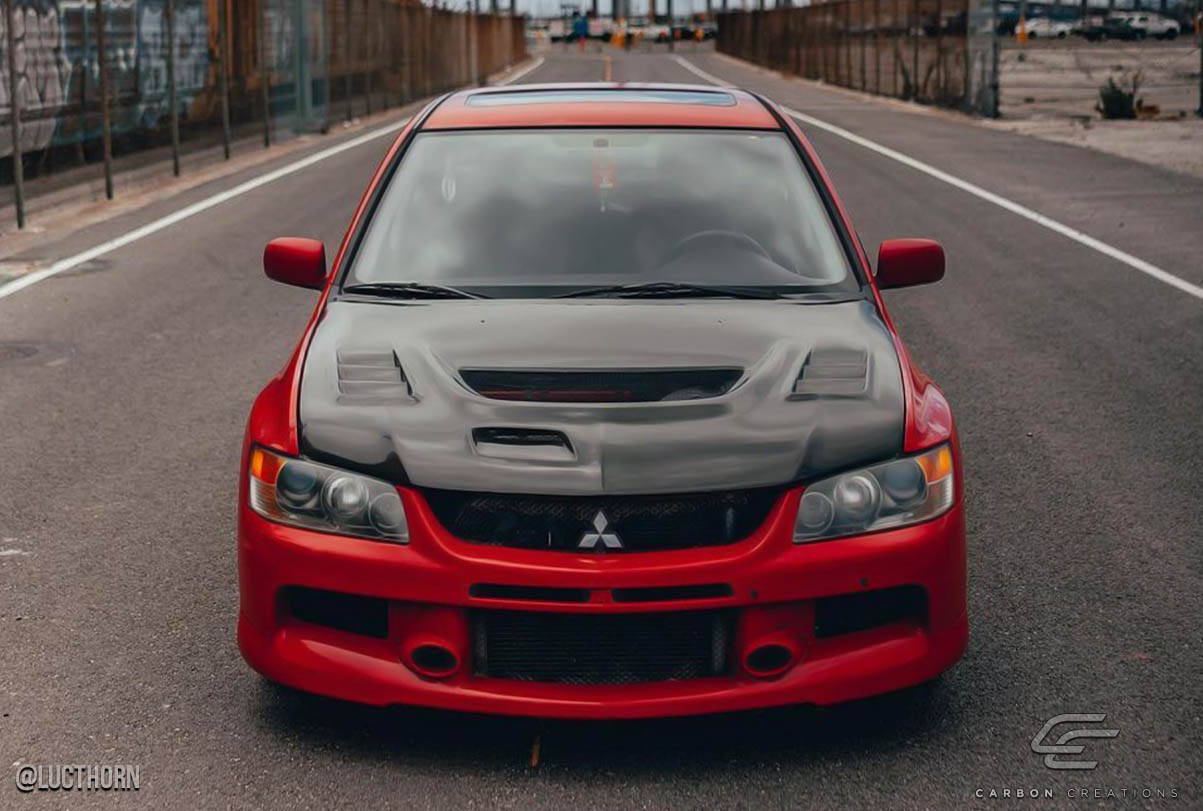 2003-2006 Mitsubishi Lancer Evolution 8 9 Carbon Creations C-1 Hood - 1 Piece / Vehicle Year Make Model Trim - 2003-2006-Mitsubishi Evolution ALL / Product Type - Hood / Style Name -C-1 / Kit Material - Carbon Fiber / Notes - Note: Hood pins are required.