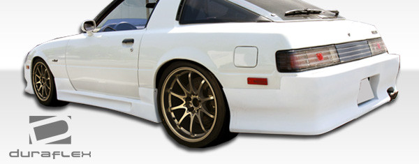 1979-1985 Mazda RX-7 Duraflex GP-1 Rear Bumper Cover - 1 Piece / Vehicle Year Make Model Trim - 1979-1985-Mazda RX7 ALL / Product Type - Rear Bumper / Style Name -GP-1 / Kit Material - FRP (Fiberglass Reinforced Plastics) / Notes -
