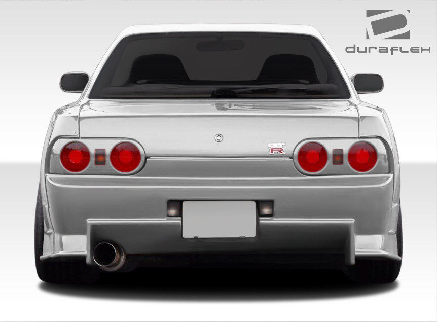1989-1994 Nissan Skyline 2DR R32 Duraflex R324 Conversion Rear Bumper Cover - 1 Piece / Vehicle Year Make Model Trim - 1989-1994-Nissan Skyline 2DR / Product Type - Rear Bumper / Style Name -R324 Conversion / Kit Material - FRP (Fiberglass Reinforced Plastics) / Notes -