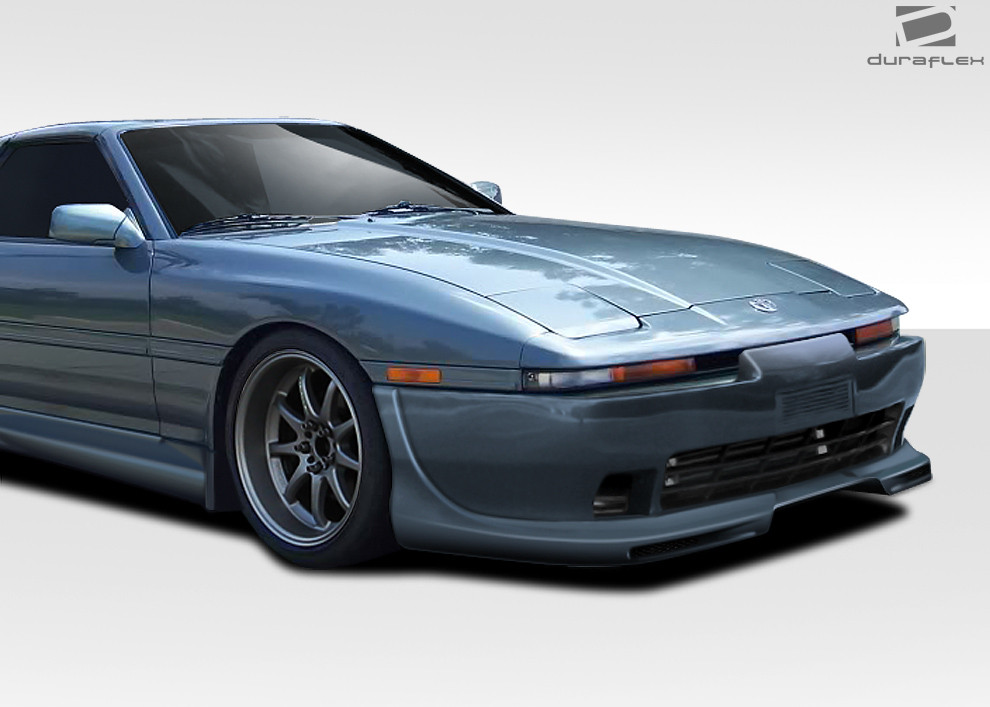1986-1992 Toyota Supra Duraflex AB-F Front Lip Under Air Dam Spoiler - 1 Piece / Vehicle Year Make Model Trim - 1986-1992-Toyota Supra ALL / Product Type - Front Lip/Add On / Style Name -AB-F / Kit Material - FRP (Fiberglass Reinforced Plastics) / Notes -