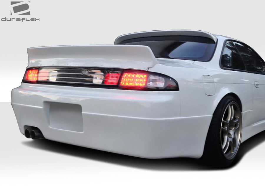 1995-1998 Nissan 240SX S14 Duraflex Supercool Rear Bumper Cover - 1 Piece / Vehicle Year Make Model Trim - 1995-1998-Nissan 240SX ALL / Product Type - Rear Bumper / Style Name -Supercool / Kit Material - FRP (Fiberglass Reinforced Plastics) / Notes -