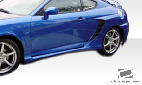 2003-2006 Hyundai Tiburon Duraflex SC-5 Body Kit - 6 Piece - Includes SC-5 Front Bumper Cover (100447) SC-5 Rear Bumper Cover (100448) SC-5 Side Skirts Rocker Panels (100450) SC-5 Rear Fender Flares (100449) / Vehicle Year Make Model Trim - 2003-2006-Hyundai Tiburon ALL / Product Type - Kit / Style Name -SC-5 / Kit Material - FRP (Fiberglass Reinforced Plastics) / Notes -