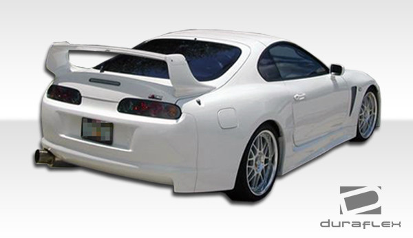 1993-1998 Toyota Supra Duraflex TD3000 Wide Body Kit - 8 Piece - Includes TD3000 Wide Body Front Bumper Cover (102526) TD3000 Wide Body Rear Bumper Cover (102529) TD3000 Wide Body Side Skirts Rocker Panels (102531) TD3000 Wide Body Front Fenders (102527) TD3000 Wide Body Rear Fenders (102530) / Vehicle Year Make Model Trim - 1993-1998-Toyota Supra ALL / Product Type - Kit / Style Name -TD3000 / Kit Material - FRP (Fiberglass Reinforced Plastics) / Notes -