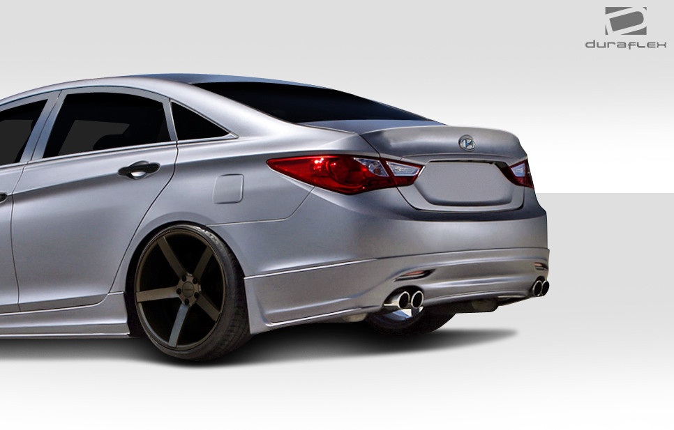 2011-2013 Hyundai Sonata Duraflex Racer Rear Lip Under Air Dam Spoiler - 1 Piece / Vehicle Year Make Model Trim - 2011-2013-Hyundai Sonata ALL / Product Type - Rear Lip/Add On / Style Name -Racer / Kit Material - FRP (Fiberglass Reinforced Plastics) / Notes -