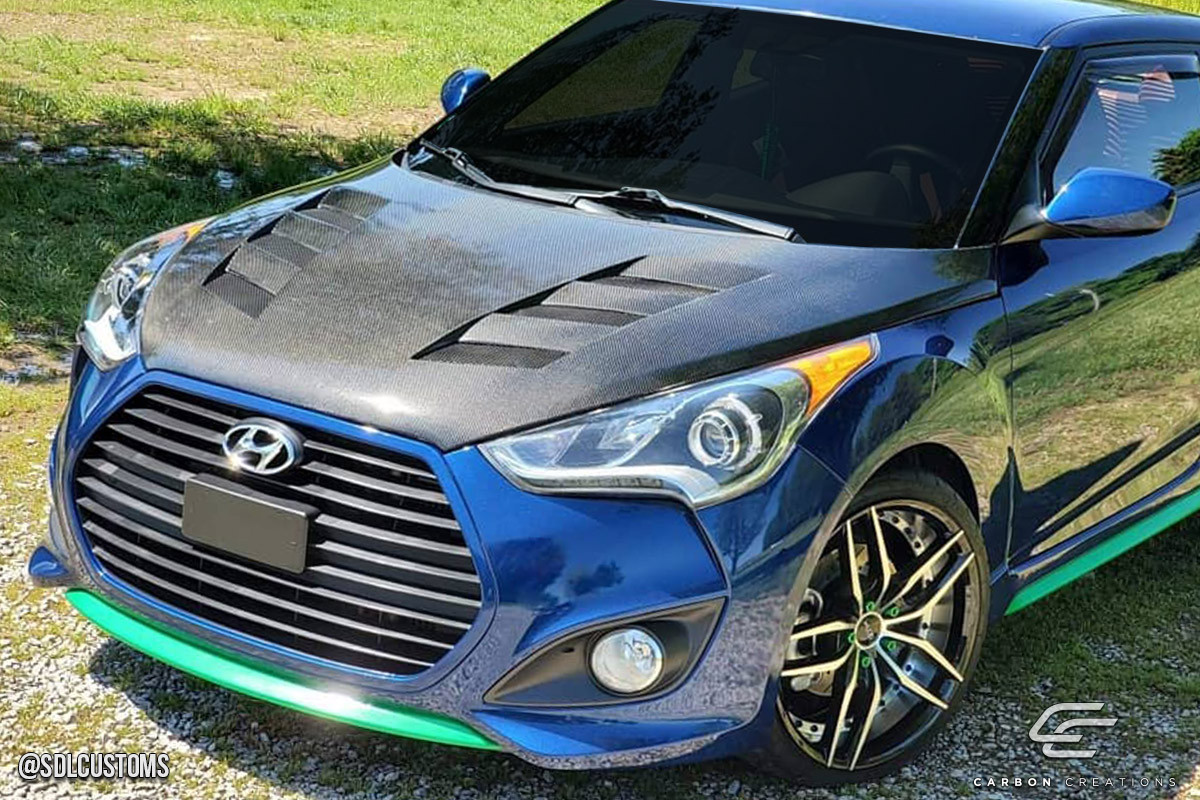 2012-2017 Hyundai Veloster Hyundai Veloster Carbon Creations DriTech AM-S Hood - 1 Piece / Vehicle Year Make Model Trim - 2012-2017-Hyundai Veloster ALL / Product Type - Hood / Style Name -AM-S / Kit Material - Carbon Fiber / Notes - Note: Hood pins are required.