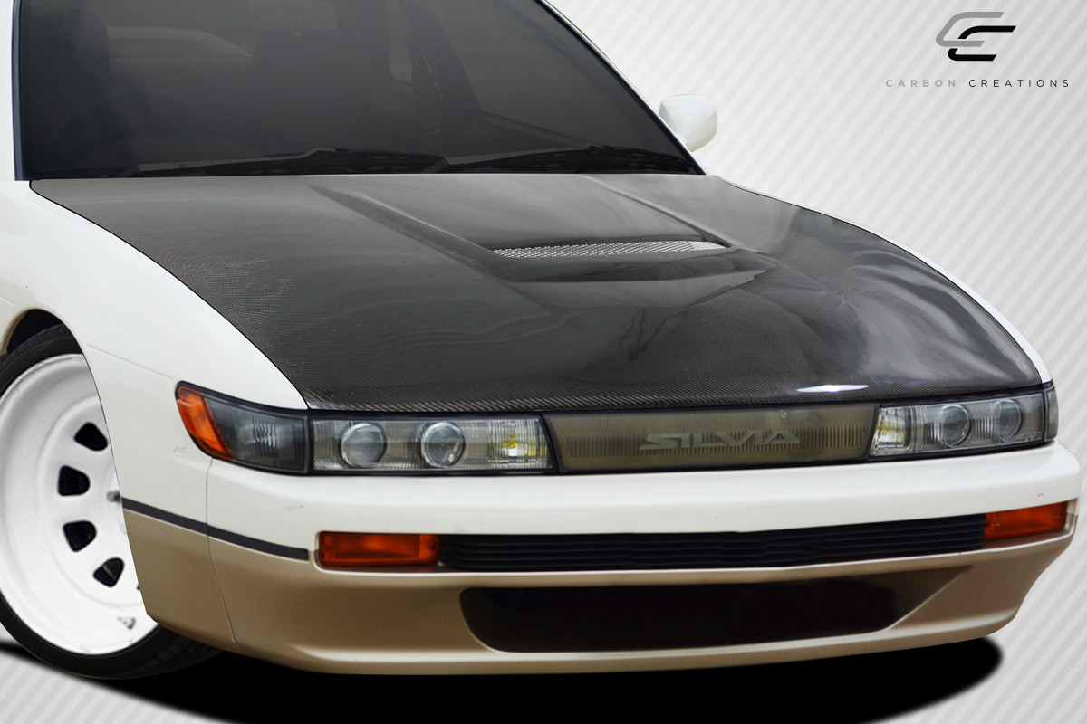 1989-1994 Nissan Silvia S13 Carbon Creations M-1 Sport Hood - 1 Piece / Vehicle Year Make Model Trim - 1989-1994-Nissan S13 Silvia ALL / Product Type - Hood / Style Name -M-1 / Kit Material - Carbon Fiber / Notes - Note: Hood pins are required.