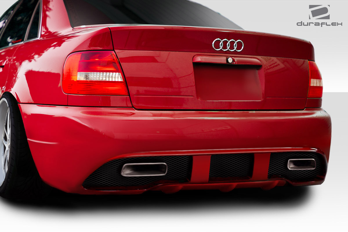 1996-2001 Audi A4 S4 B5 4DR Duraflex Version 1 Rear Bumper - 1 Piece / Vehicle Year Make Model Trim - 1996-2001-Audi A4 4DR / Product Type - Rear Bumper / Style Name -Version 1 / Kit Material - FRP (Fiberglass Reinforced Plastics) / Notes -