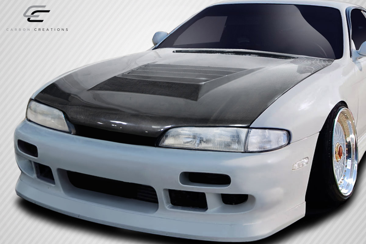 1995-1996 Nissan 240SX S14 Carbon Creations D-Spec Hood - 1 Piece / Vehicle Year Make Model Trim - 1995-1996-Nissan 240SX ALL / Product Type - Hood / Style Name -D-Spec / Kit Material - Carbon Fiber / Notes - Hood pins are required.
