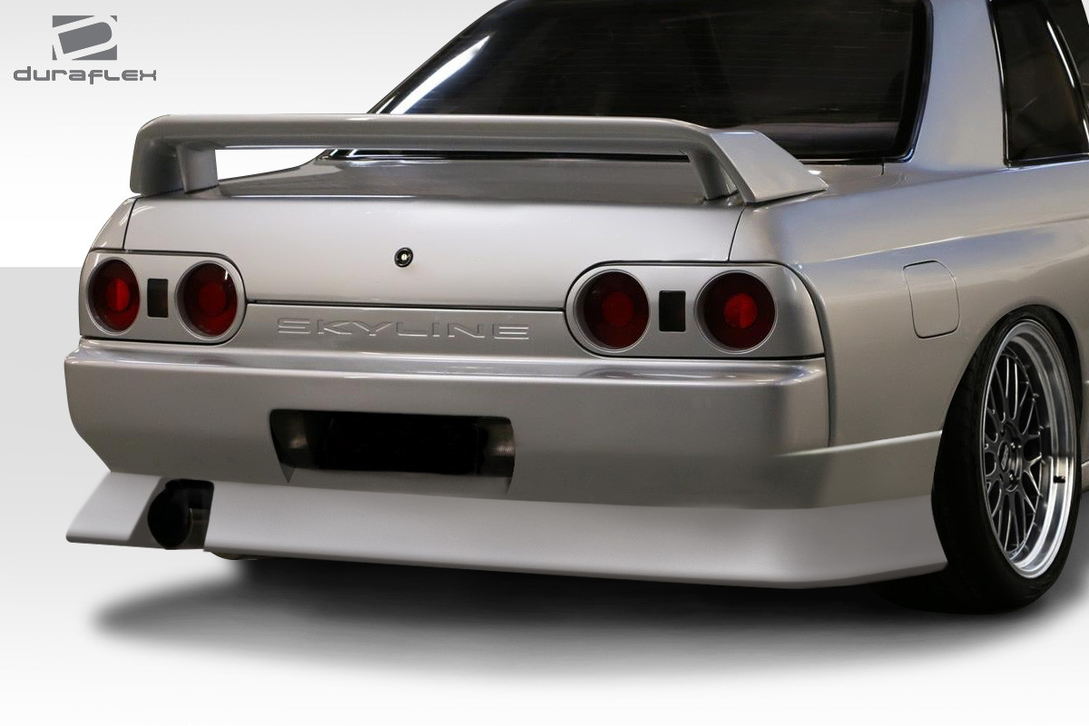 1989-1994 Nissan Skyline R32 2DR Duraflex B-Sport Rear Bumper Cover - 1 Piece / Vehicle Year Make Model Trim - 1989-1994-Nissan Skyline 2DR / Product Type - Rear Bumper / Style Name -B-Sport / Kit Material - FRP (Fiberglass Reinforced Plastics) / Notes -