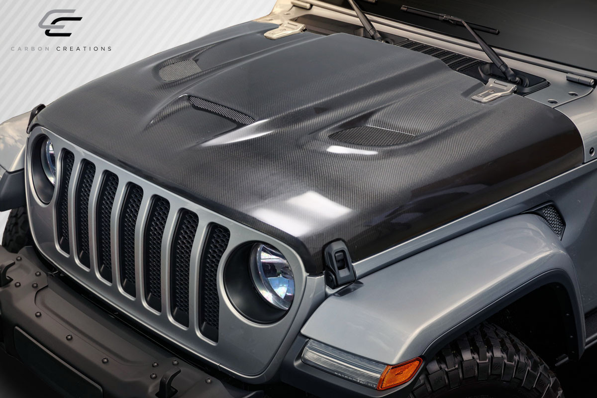 2018-2025 Jeep Wrangler JL Gladiator JT Carbon Creations Hellcat Look Hood - 1 piece / Vehicle Year Make Model Trim - 2018-2025-Jeep Wrangler ALL / Product Type - Hood / Style Name -Hellcat / Kit Material - Carbon Fiber / Notes - Note: Hood pins are required.