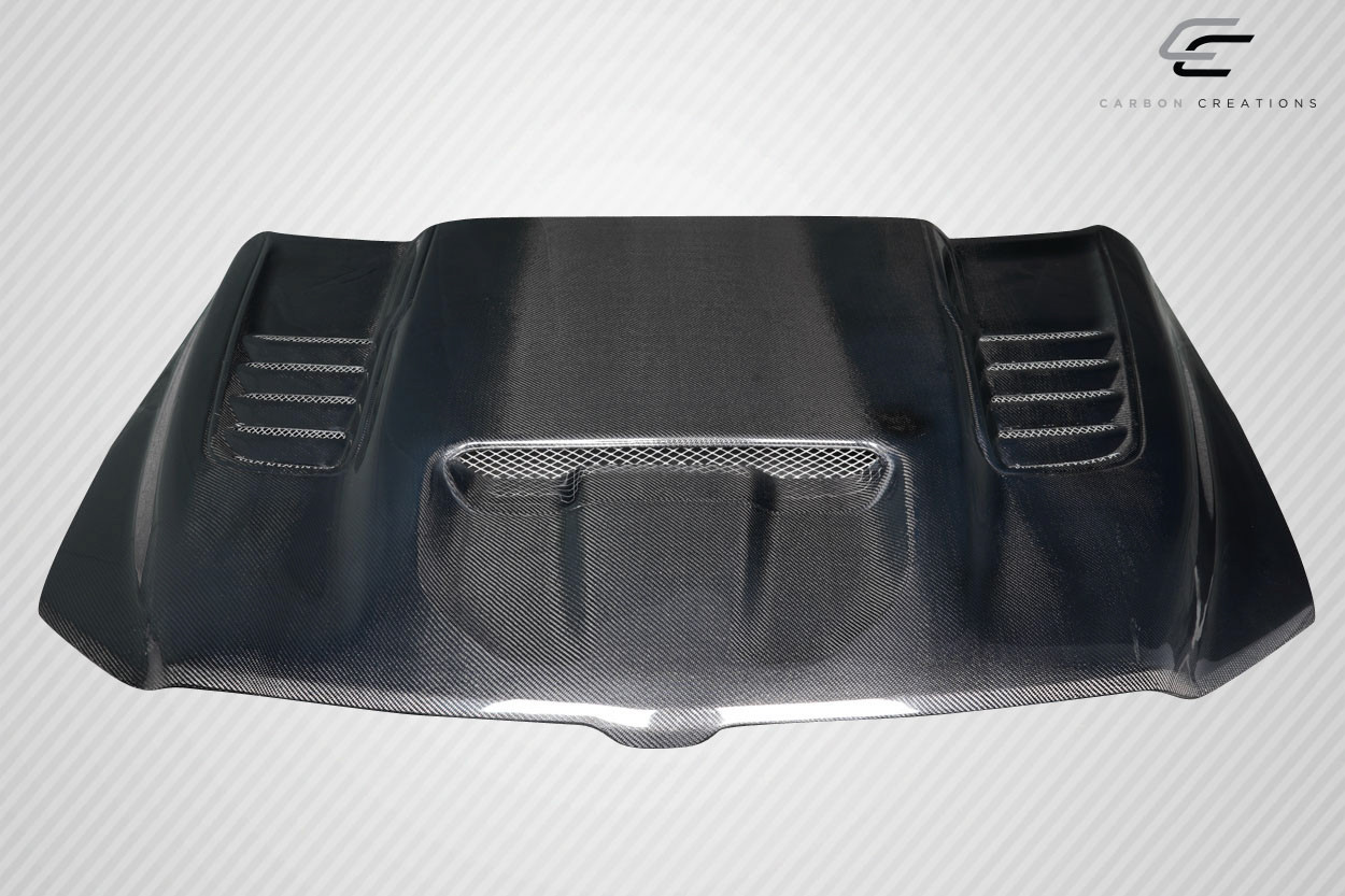 2019-2025 Dodge Ram 1500 Carbon Creations TRX Look Hood - 1 Piece / Vehicle Year Make Model Trim - 2019-2025-Dodge Ram ALL / Product Type - Hood / Style Name -TRX Look / Kit Material - Carbon Fiber / Notes -