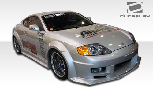 2003-2006 Hyundai Tiburon Duraflex Poison Flared Front Bumper Cover - 1 Piece (S) / Vehicle Year Make Model Trim - 2003-2006-Hyundai Tiburon ALL / Product Type - Front Bumper / Style Name -Poison / Kit Material - FRP (Fiberglass Reinforced Plastics) / Notes -